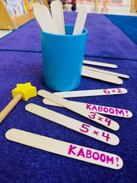 Kaboom3 Popsicle sticks with writing on them
