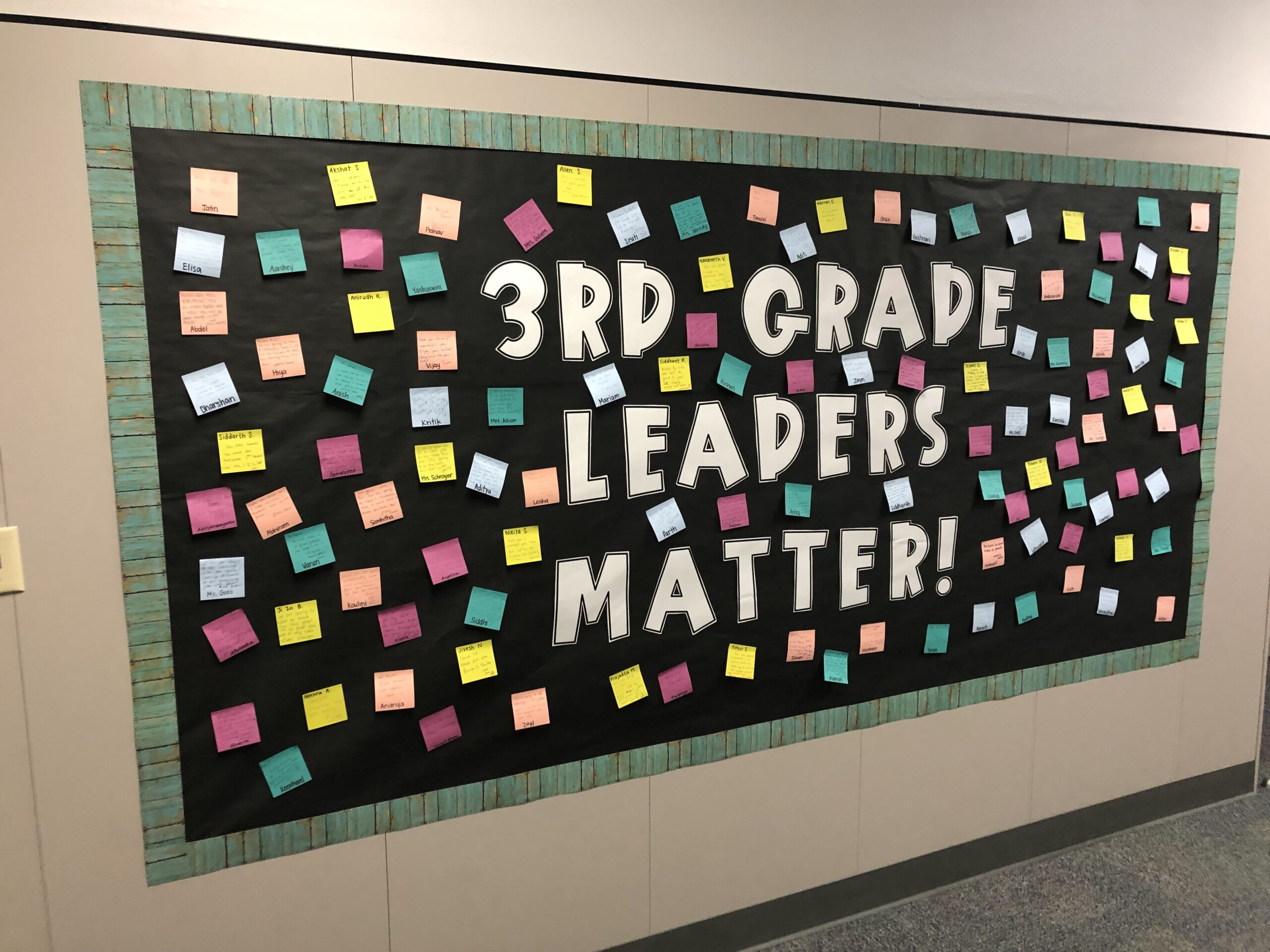 Leaders-Brooke-Blake A black bulletin board says 3rd grade leaders matter. It has post its from kids all over it.