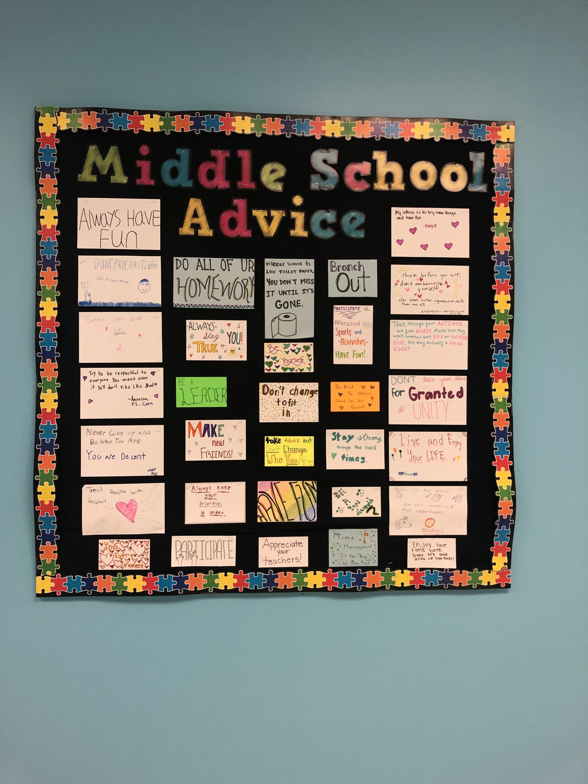 MiddleSchooladvice A Board says Middle School Advice and has papers written by kids on it.