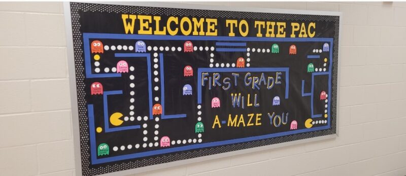 PacMan-Shuwanna A bulletin board is designed to look like a Pac-Man screen. Letters read Welcome to the First Grade.