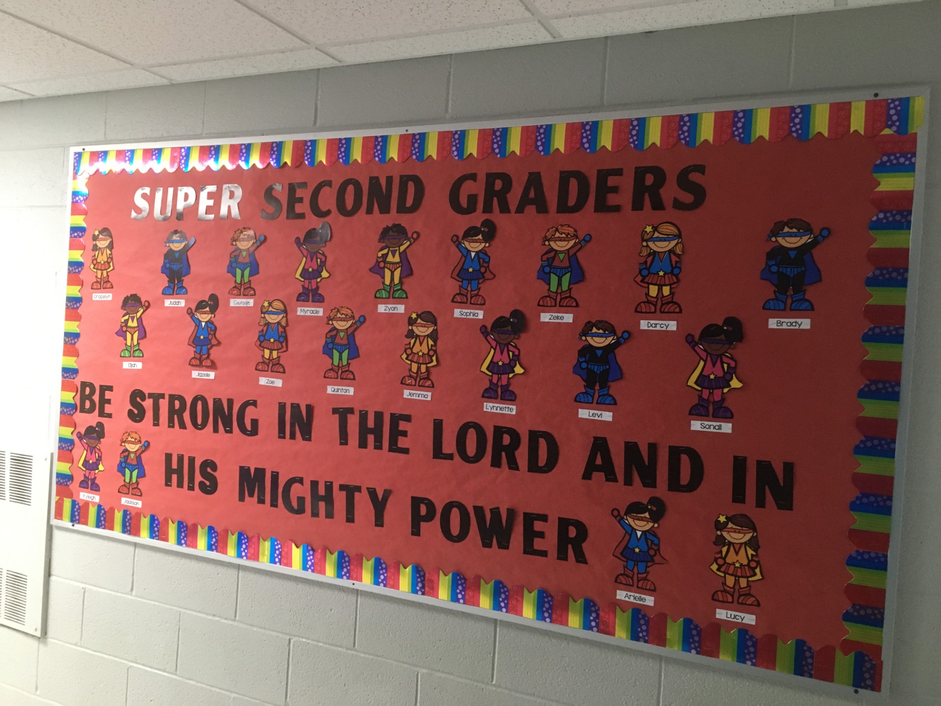 Superheroes-1 A bulletin board features little superheroes with student names on them.
