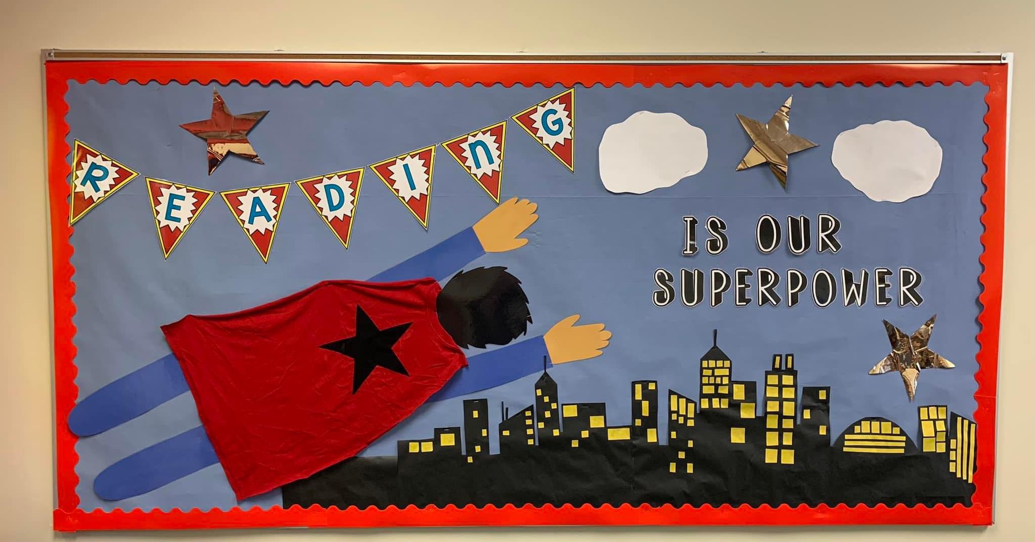 Superpower-Amy-Brownlee A bulletin board shows superman flying across it and says Reading is my Superpower.