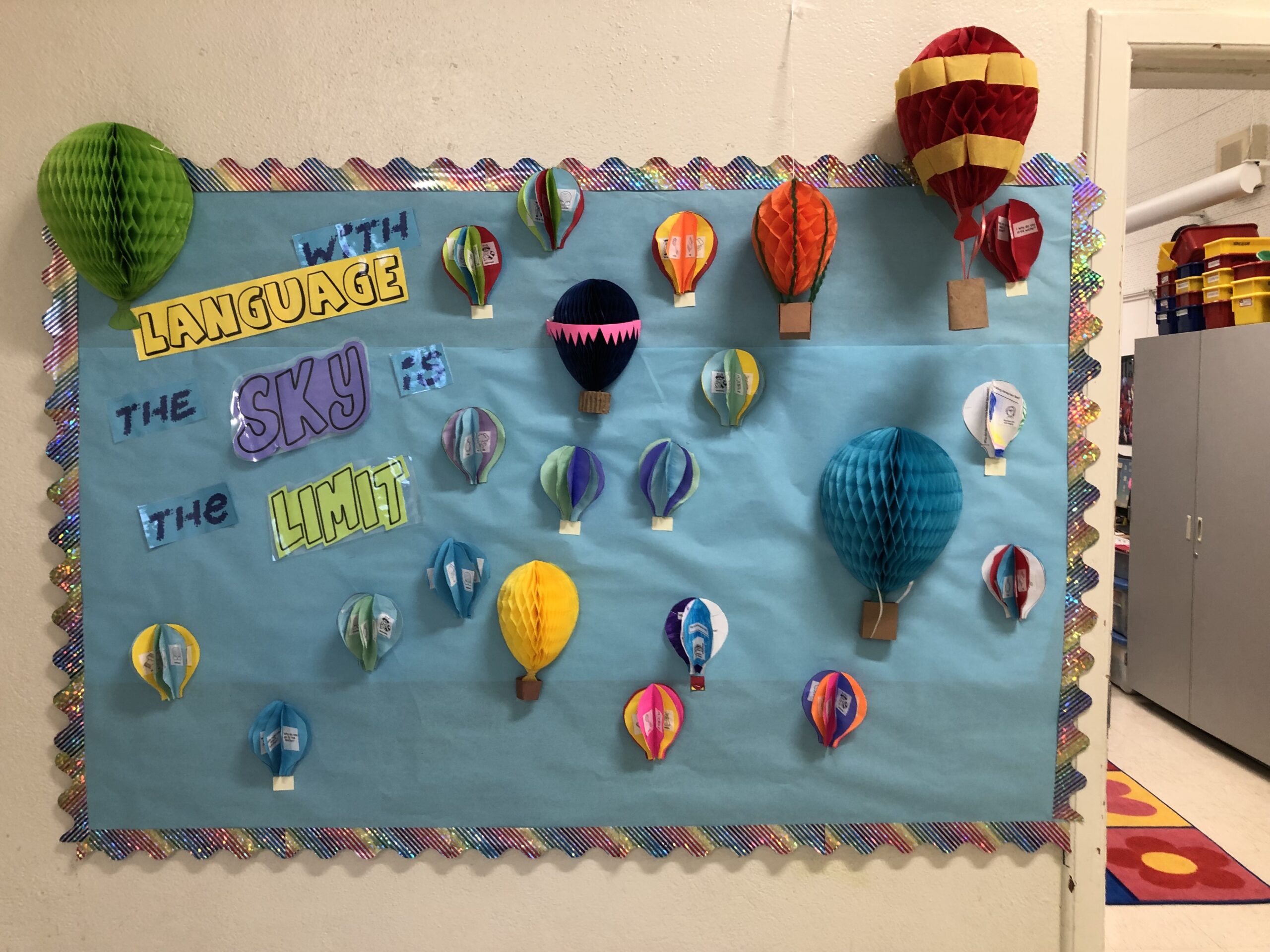 Hot Air Balloon 3-D hot air balloons decorate a bulletin board.