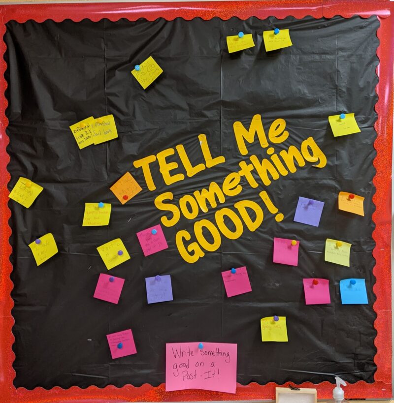 Tell Me Something Good Bulletin Board A bulletin board with a black background reads Tell Me Something Good. Sticky notes are attached with good news from students about their week.