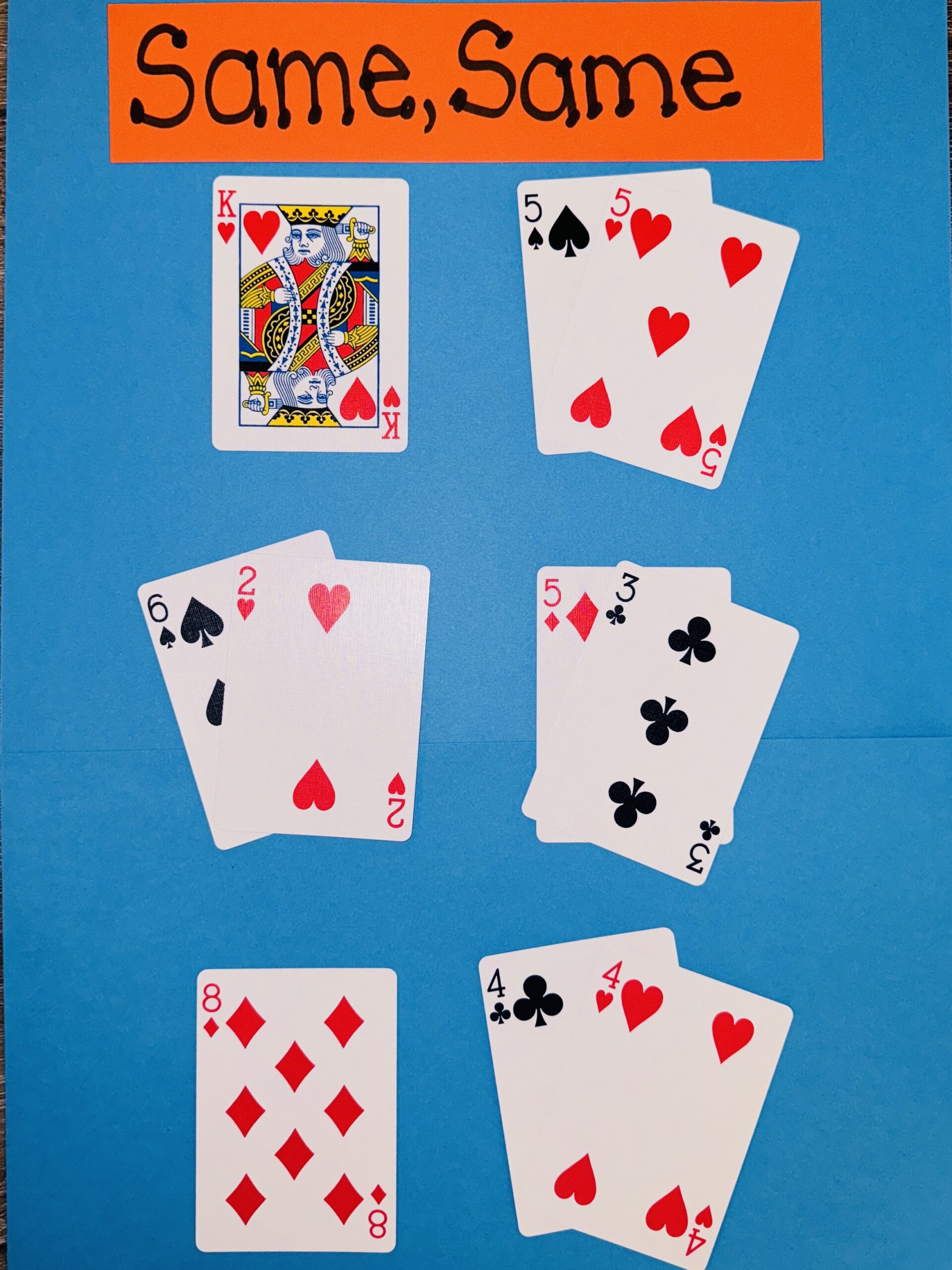 Same, Same Deck of cards set up to play Same, Same