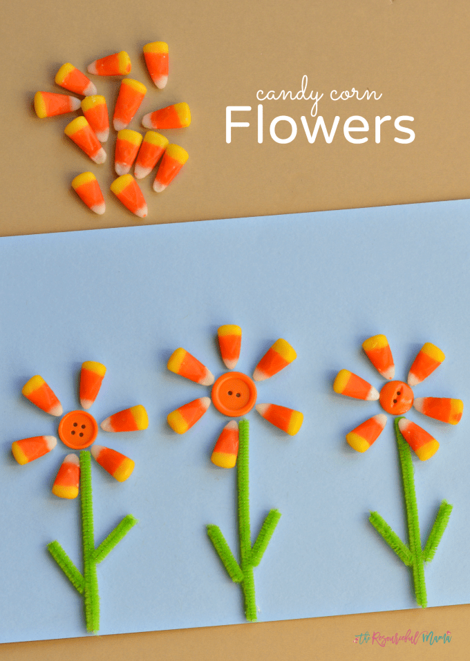 Three flowers are made from candy corn.