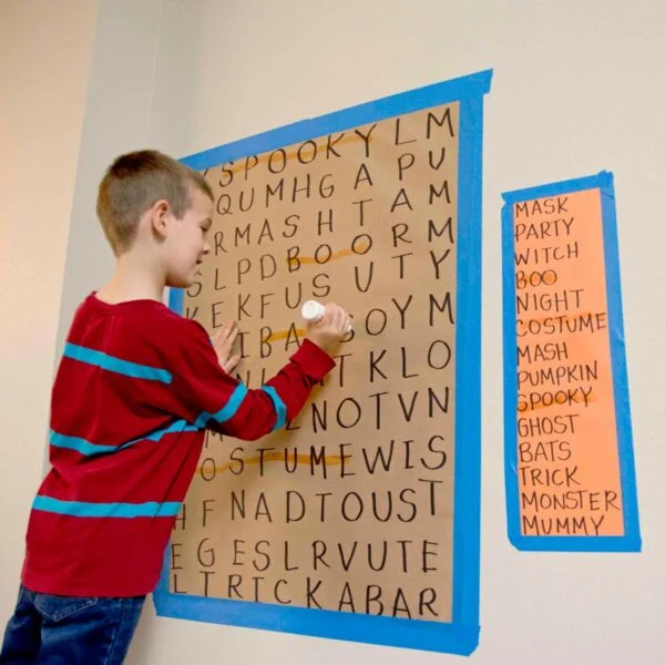 giant-word-search Boy solves large word search puzzle taped to the wall