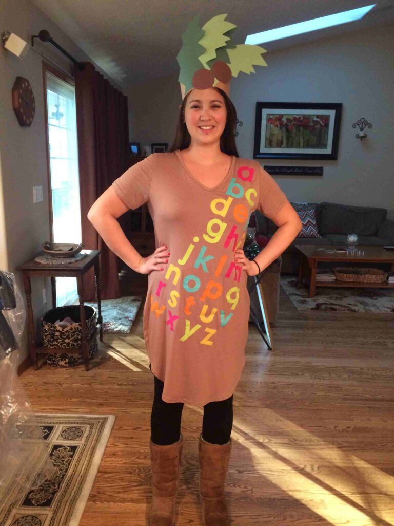 Book Character Costumes: Chicka Chicka Boom Boom Teacher dressed as the palm tree from the book Chicka Chicka Boom Boom