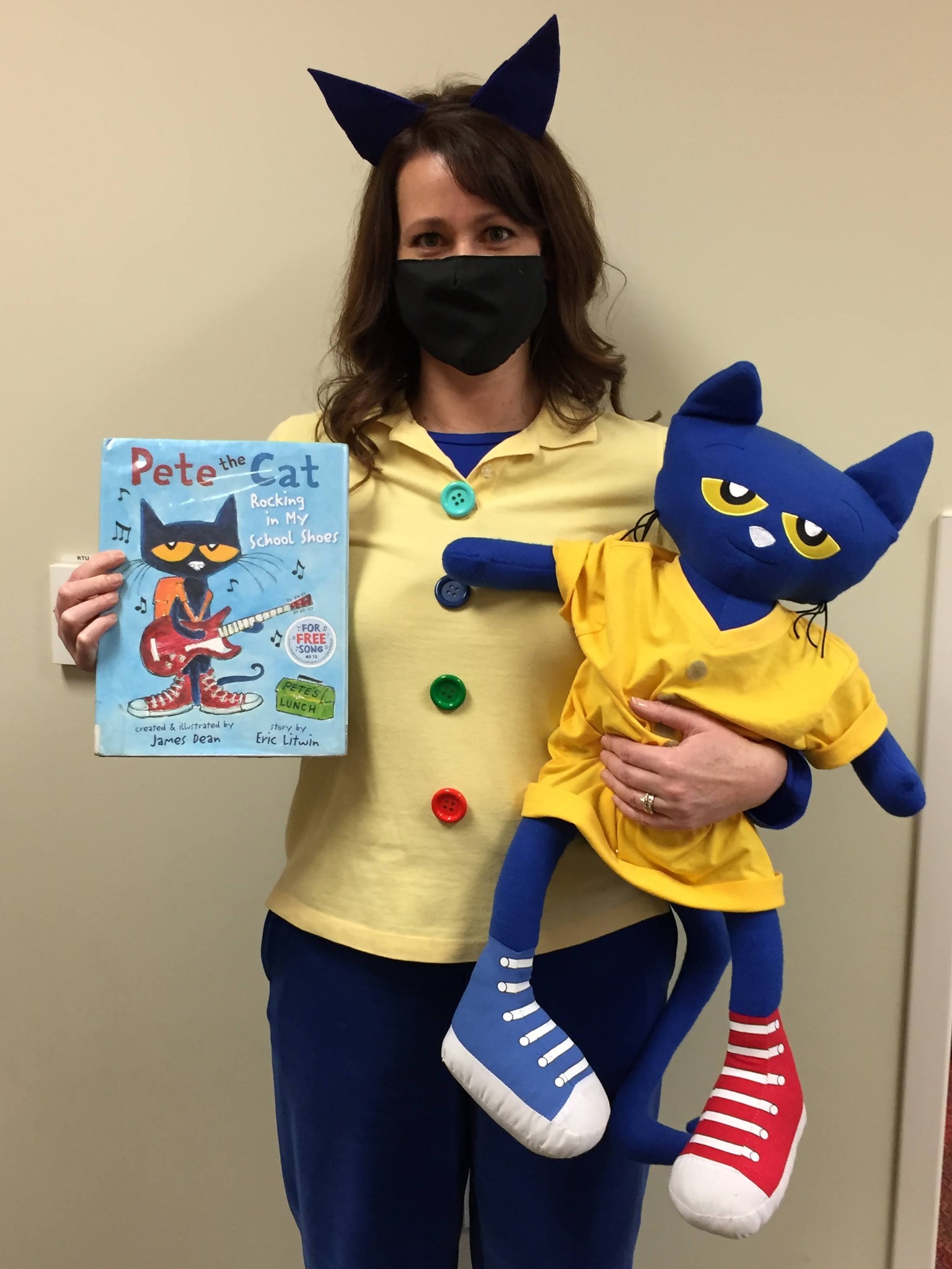 Halloween Costumes: Pete the Cat Librarian dressed as Pete the Cat, holding a stuffed Pete and a copy of a Pete the Cat book