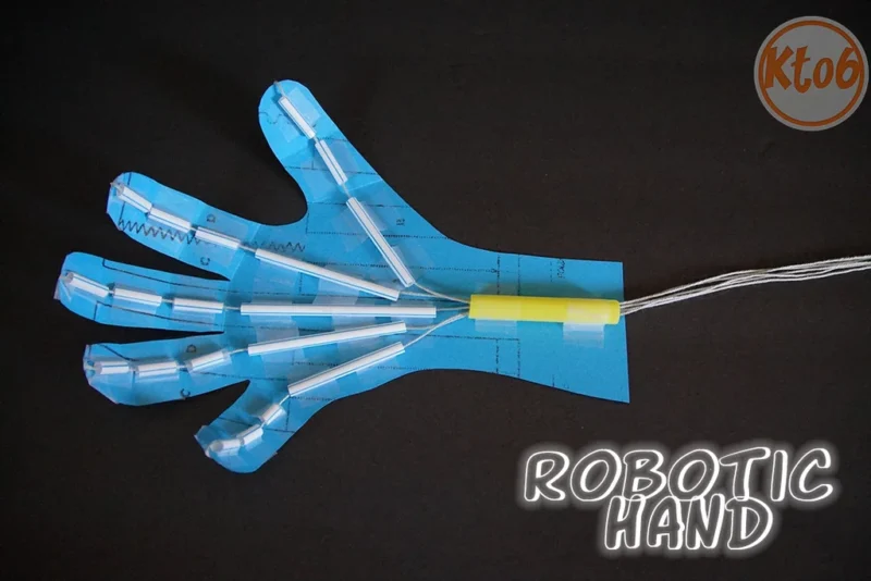 robotic-hand A robotic hand made from blue construction paper, segments of a drinking straw and string