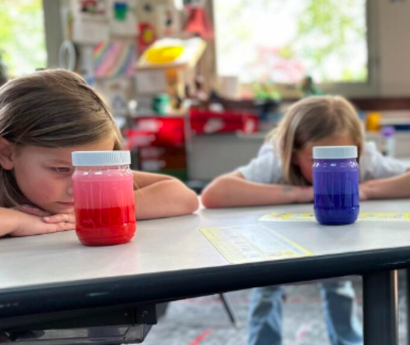 calm-down-jars Two students stare at a calm down jar on their desks for a social emotional learning activity