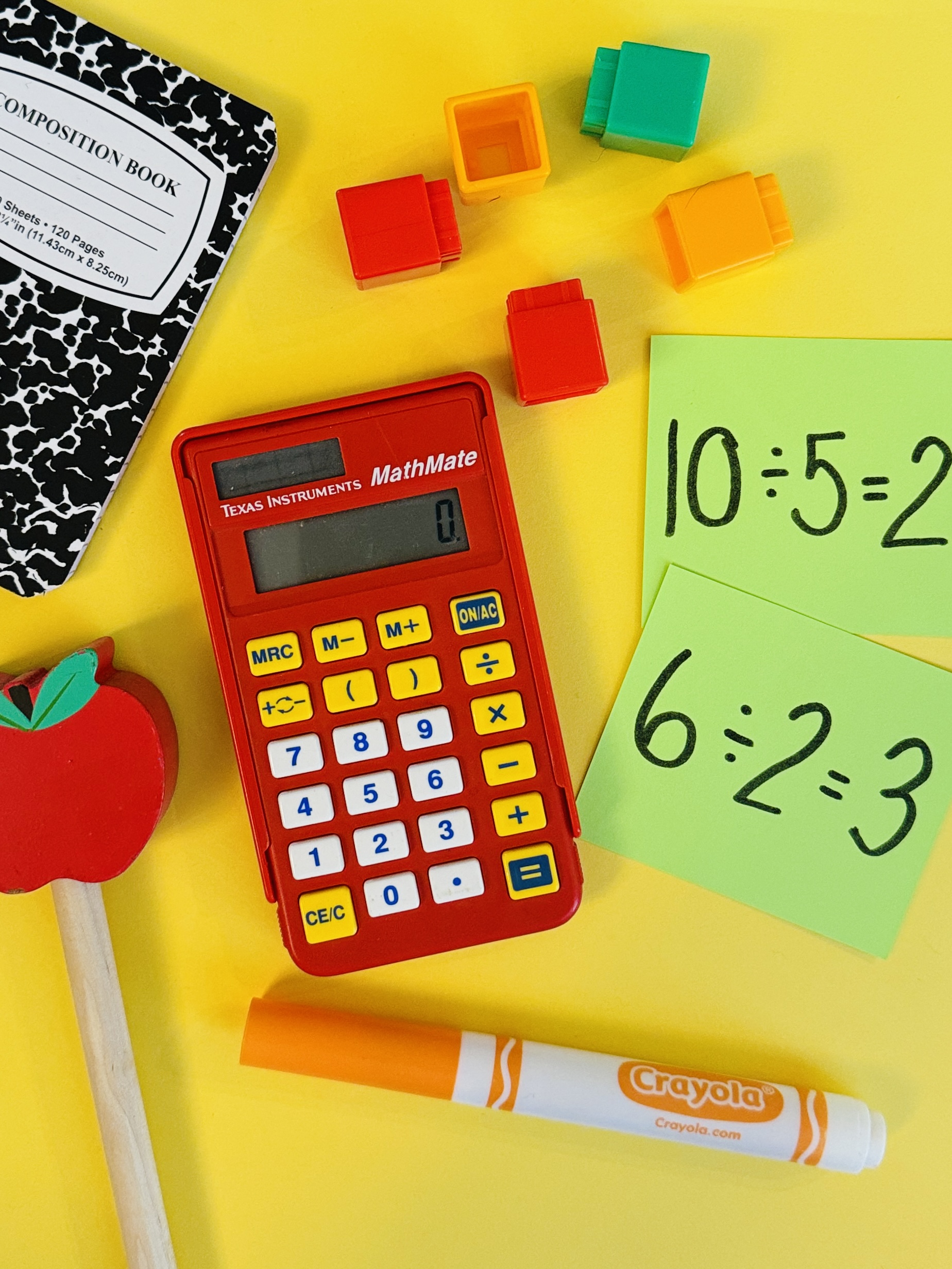 CalculatorDivisionChecker Red calculator and flashcards with division equations on them