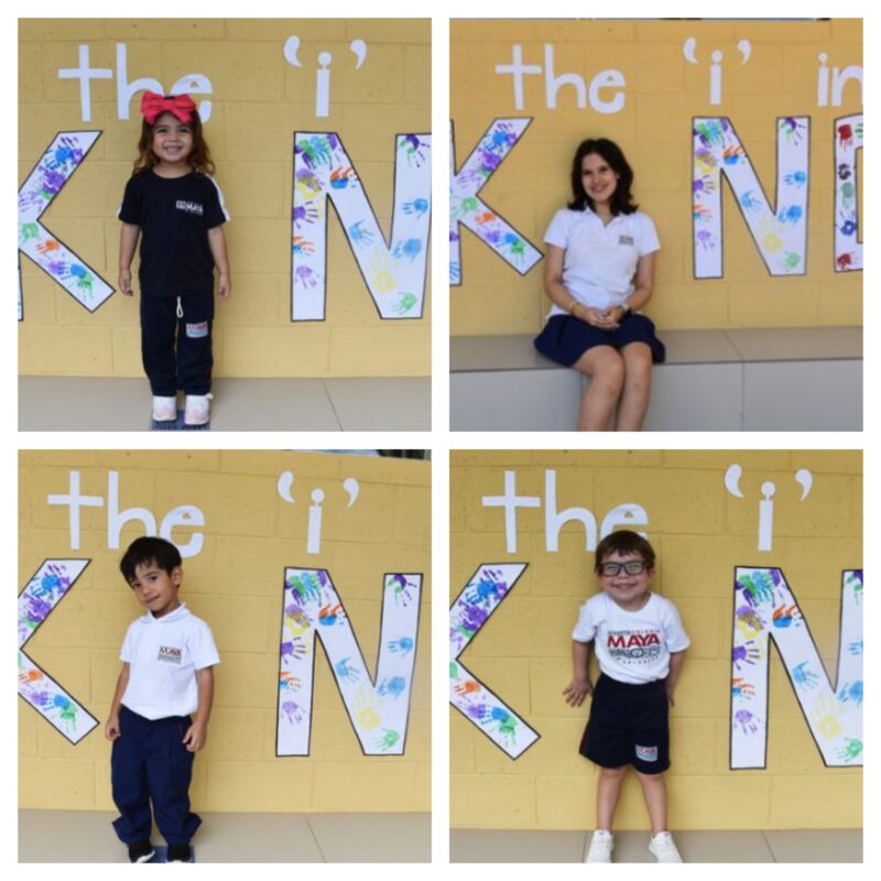 KIND (1) Students sit in front of a wall that reads be the