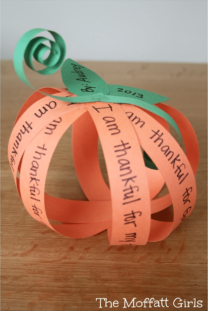 paper-strip-pumpkin A pumpkin made from orange strips of paper, each with something the maker is grateful for written on it