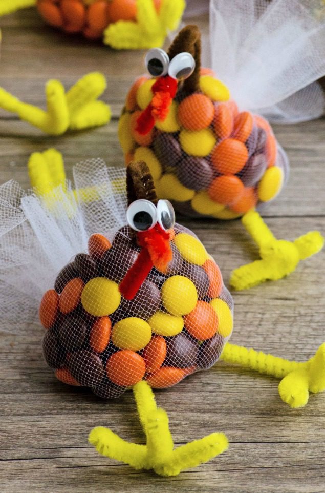 candy-turkey A netted bag embellished to look like a turkey is filled with fall colored candies