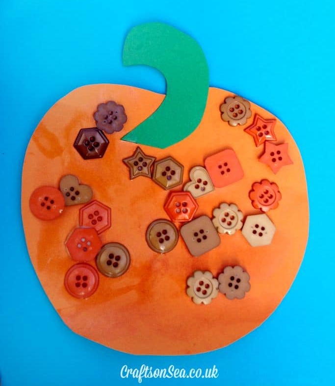 button-pumpkin Orange paper pumpkin with buttons glued all over it