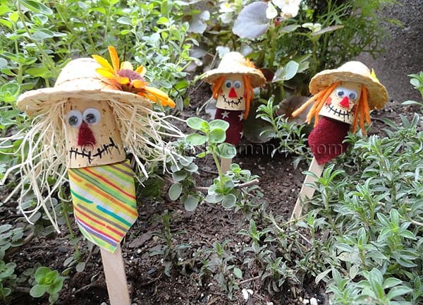 craft-stick-scarecrows Paper bag scarecrows guard a garden