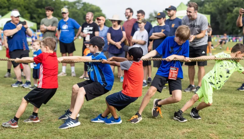 field-day Boys holding a tug of war competition