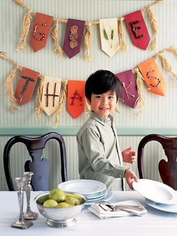 nature-banner A boy stands in front of a banner that reads Give Thanks