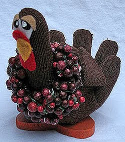 glove-turkey A brown knit glove stuffed and decorated to look like a turkey
