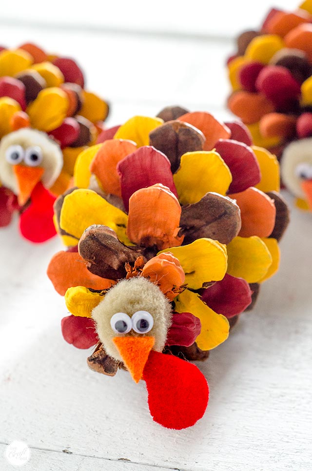 painted-pinecone-turkeys A pinecone turkey with each of the sections of the pinecone painted a different color