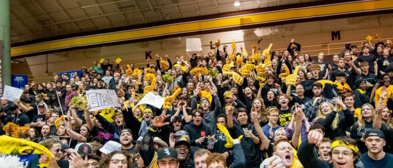 student-cheering-question Student section cheering in an auditorium