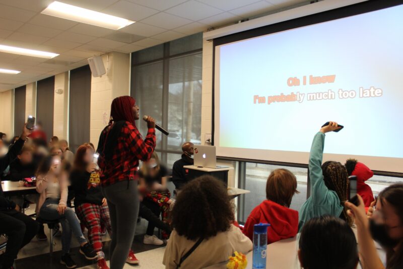 student karaoke A student sings karaoke from words on a screen