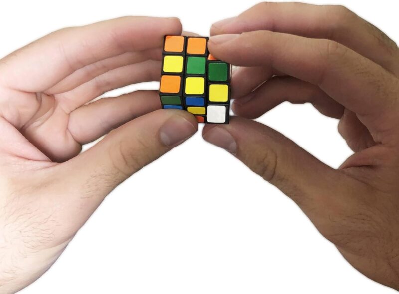 mini-rubiks-cube A child's hands hold a mini rubik's cube