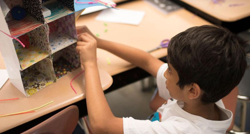 Invention Ideas for Kids: Living Space A child working to invent a new kind of living space, using cardboard and other basic supplies as an example of invention ideas for kids