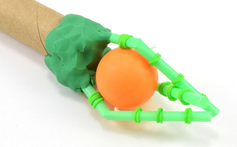 Invention Ideas: Mechanical Hand Mechanical hand made from supplies like drinking straws, clay, and cardboard as an example of invention ideas for kids