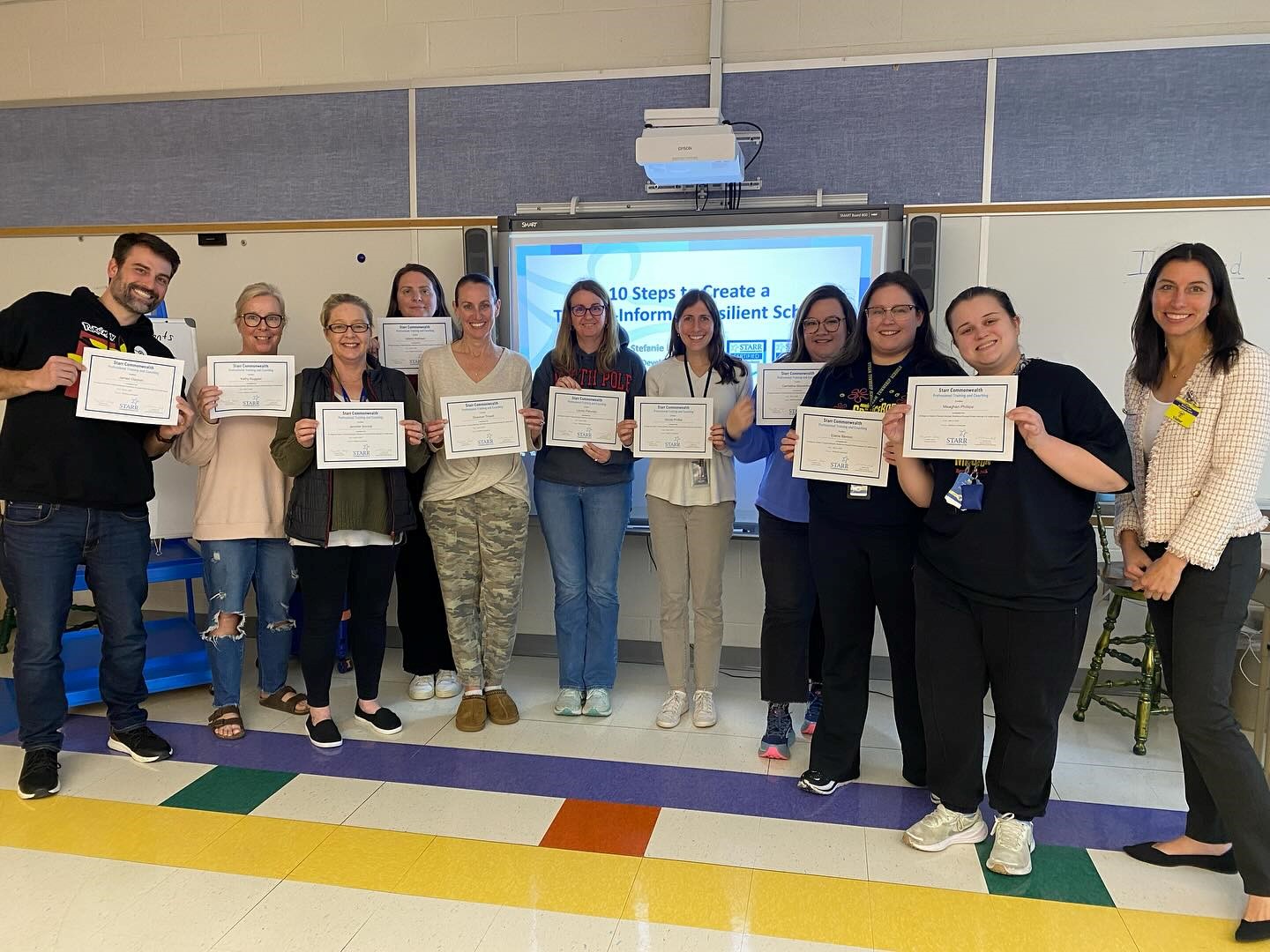 Understanding Trauma Changed My Teaching … and My Students’ Lives Image of New Jersey teacher of the year with a group of teachers she trained