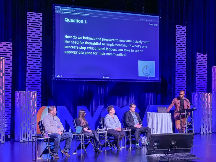 Ross Klein-Mann (center) participates in a recent presentation about AI.
