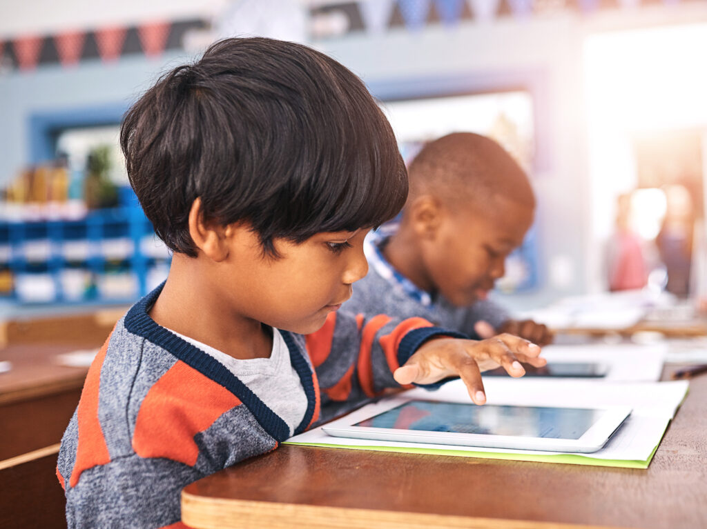 h books in classroom for online learning, studying and knowledge. Education, academy and young boy with textbooks and digital tech for lesson, development and research