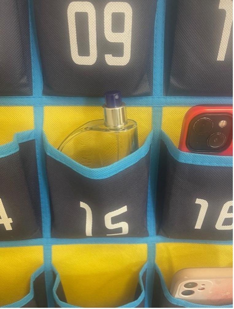 Photo of cologne bottle hanging in the phone organizer