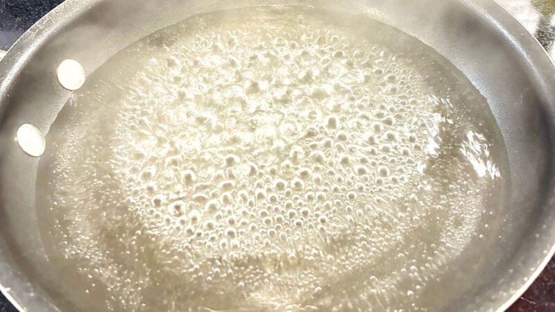 a close up image of boiling water: water turning into gas