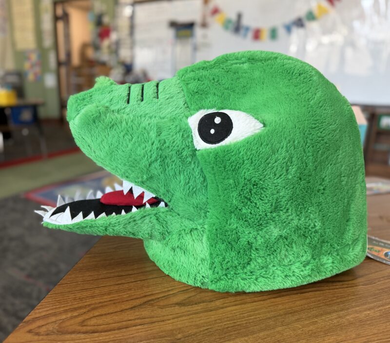 dinosaur head alone in classroom