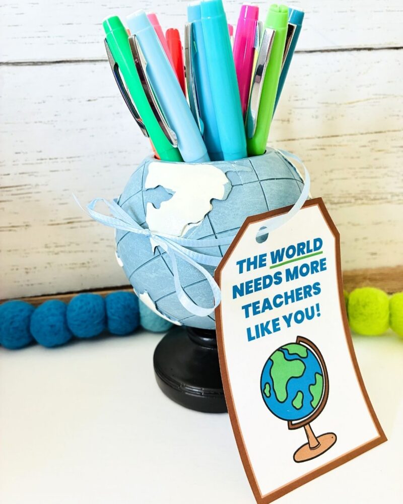 an image of a teacher gift with a gift tag for teachers printable: globe pen holder