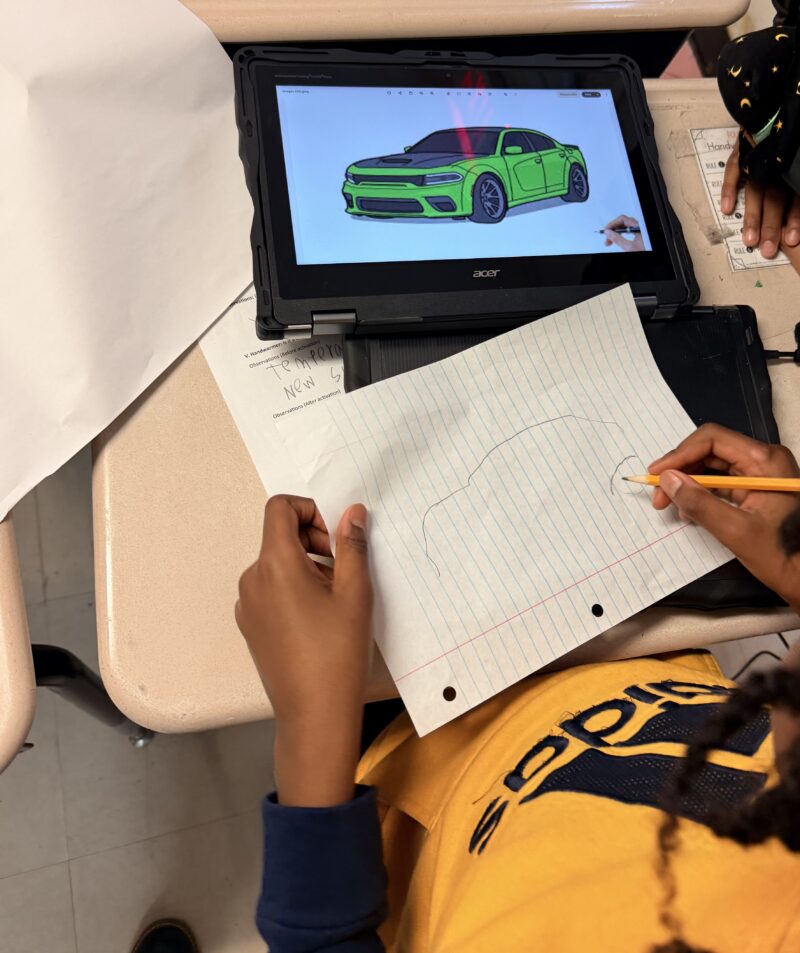 Race Car Lesson 4 Students designing cars during a lesson as part of The Henry Ford inHub Model i curriculum.
