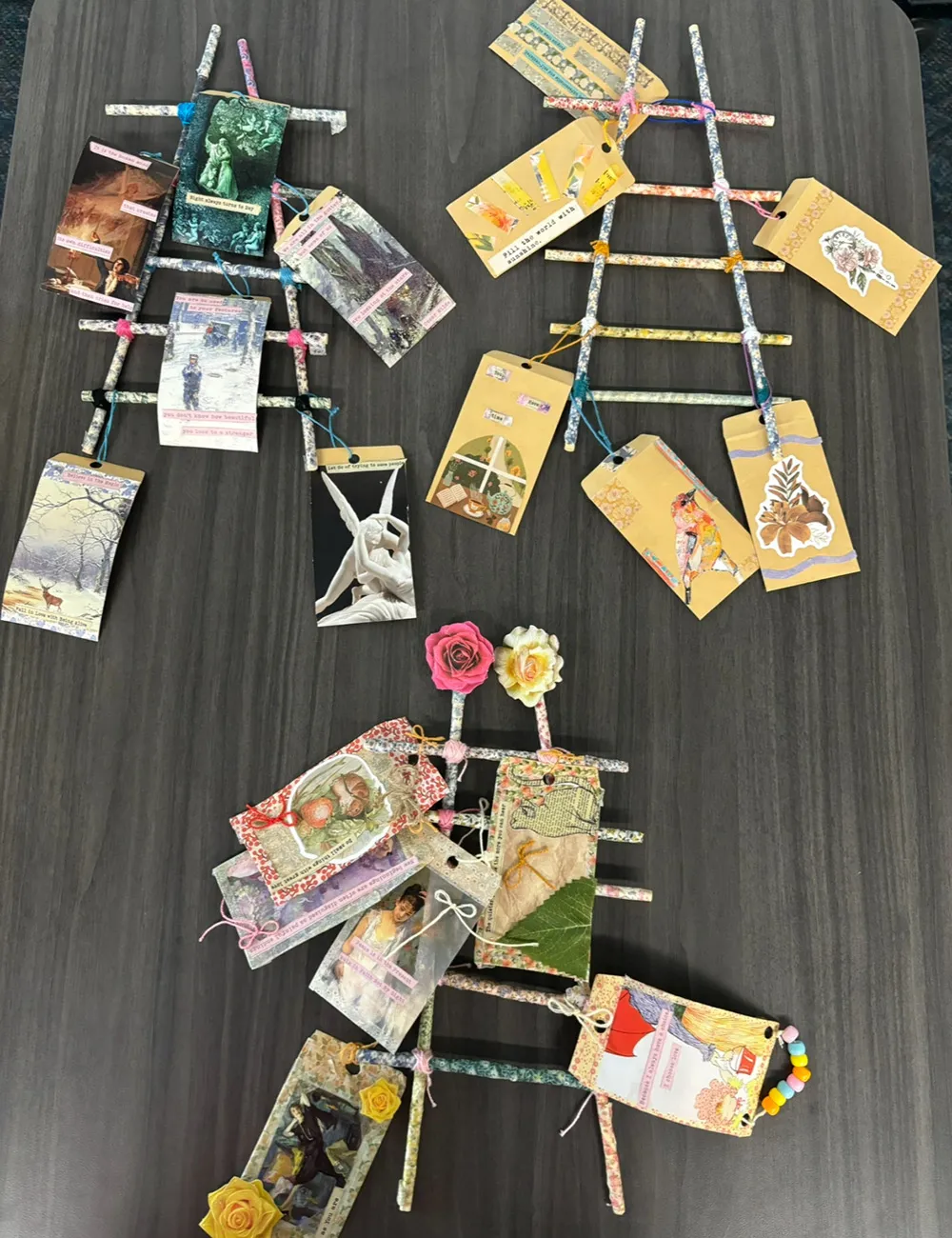 3 student-made polyvagal ladders, each with 6 envelopes tied to them